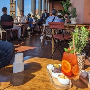 Aperitivo on the terrace of Hotel Guadagni in Florence on a sunny day