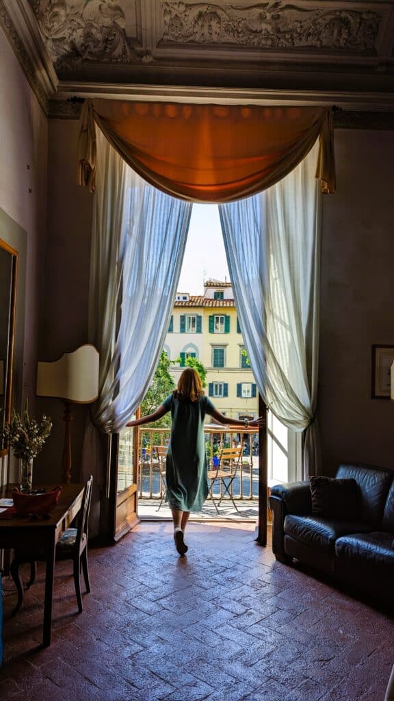Tall doors opening out from Palazzo Guadagni onto the Piazza Santo Spirito in Florence