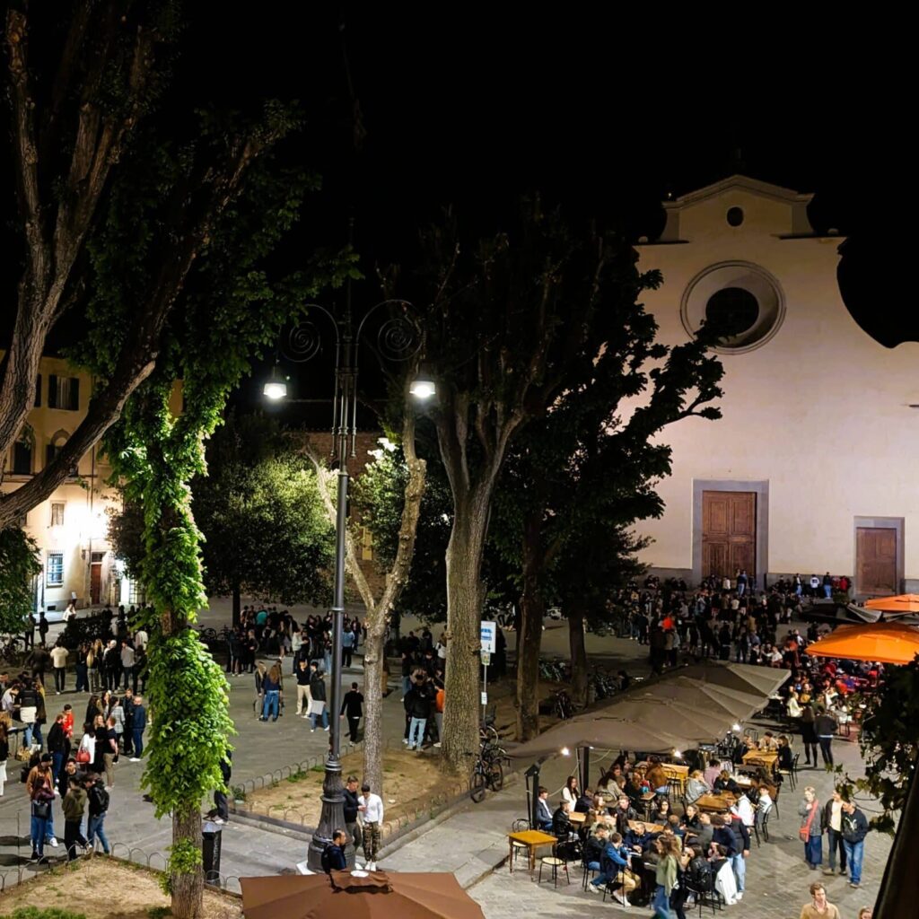 View of nightlife in Piazza Santo Spirito in Florence from terrace of Hotel Guadagni