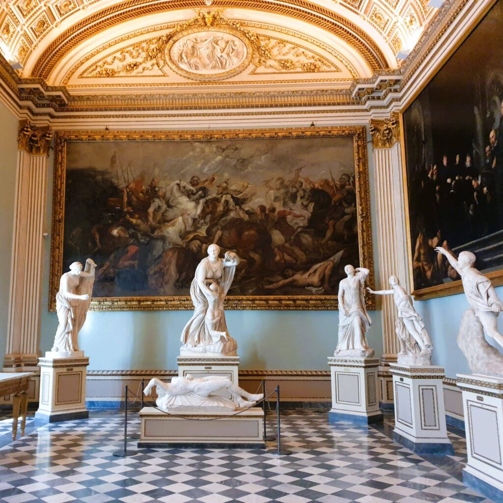 Marble statues in ornate room at the Uffizi Gallery in Florence